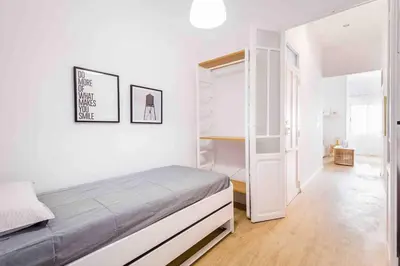 a bedroom with a bed in a white room at Cozy apartment Valencia city center! in Valencia