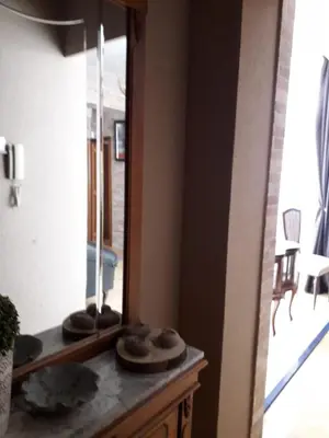 a mirror sitting on top of a dresser in a room at Carrer Roma in Sagunto
