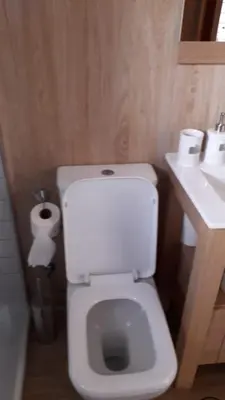 a bathroom with a white toilet and a sink at Carrer Roma in Sagunto