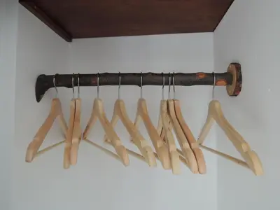 a bunch of wooden cooking utensils hanging on a wall at Finca Mirador in Macastre