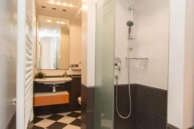 a bathroom with a shower and a sink at Los Olivos Apartment Cullera in Cullera