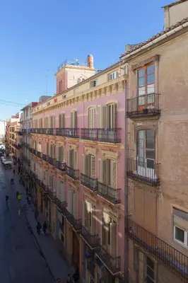 a row of buildings on a city street at FLORIT FLATS - Apartment Torres de Quart I in Valencia
