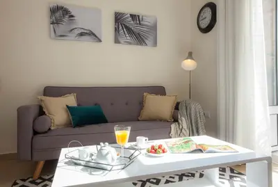 a living room with a couch and a coffee table at SingularStays Seu Catedral in Valencia
