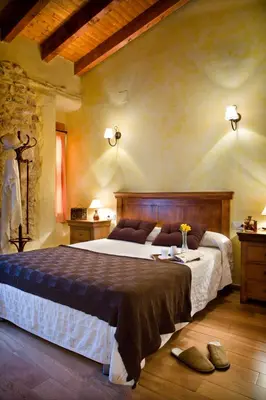 a bedroom with a large bed in a room at Valterra y Tosal in Torres-Torres