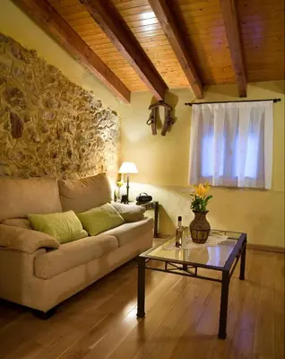 a living room with a couch and a table at Valterra y Tosal in Torres-Torres