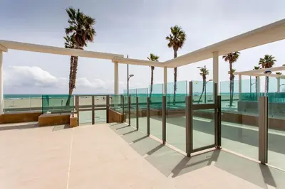 a view of the ocean from the balcony of a resort at ApartUP Patacona Select in Valencia