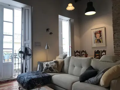 a living room with a couch and a fan at Appartement Elsa Valencia in Valencia