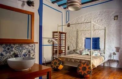 a bedroom with a bed and a sink in it at DOMUS Amabilis in Sagunto