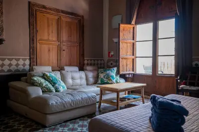 a living room with a couch and a table at DOMUS Amabilis in Sagunto