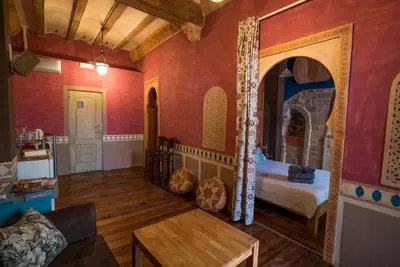 a room with a bedroom with a bed in it at DOMUS Amabilis in Sagunto
