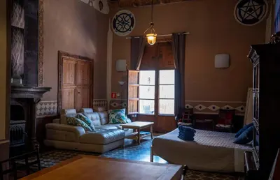 a living room with a couch and a chair at DOMUS Amabilis in Sagunto