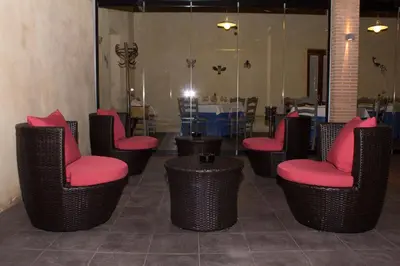 a group of chairs with red seats in a room at Hotel-Restaurante Casa Blava Alzira in Alzira