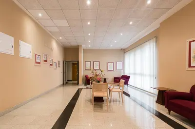 a hospital hallway with a table and chairs at PATACONA BEACH VISTAS AL MAR in Valencia