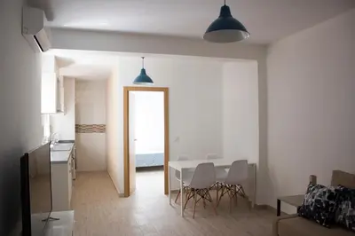 a kitchen and dining room with a table and chairs at Campanar flat 2 in Valencia