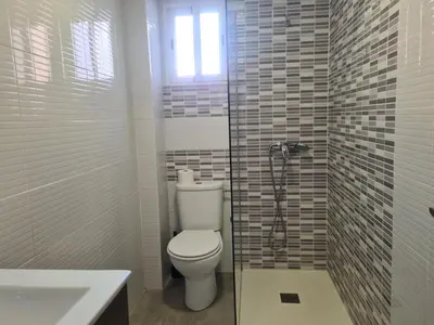a bathroom with a toilet and a sink and a shower at Campanar flat 2 in Valencia