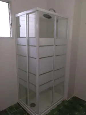a glass shower in a corner of a bathroom at Casa Vall de Almonacid in Vall de Almonacid
