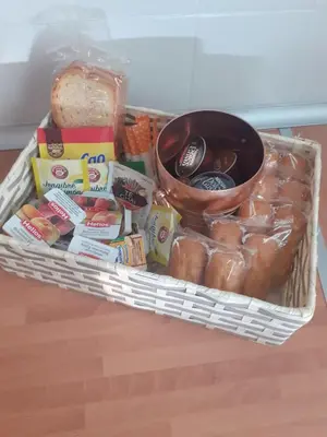 a basket filled with different types of food and bread at Casa Vall de Almonacid in Vall de Almonacid