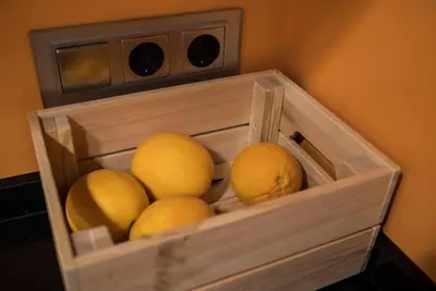 a bunch of yellow fruit in a wooden box at Céntrico y reformado con estilo in Valencia