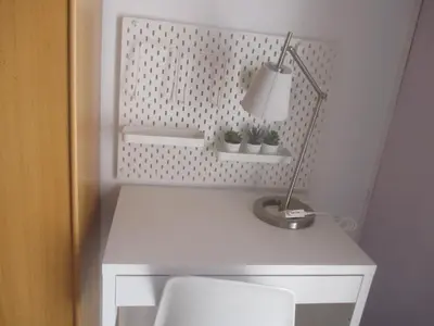 a white desk with a lamp and plants on it at Casa Valle del Turia in Chulilla