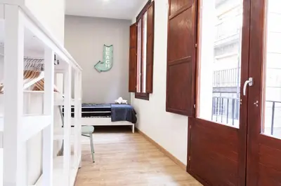 a room with a staircase and a bunk bed at Plaza Redonda Center in Valencia