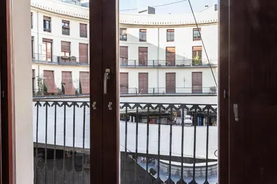 an open door with a view of a building at Plaza Redonda Center in Valencia