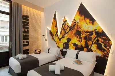 a hotel room with two beds and a painting on the wall at Casual Socarrat Valencia - Adults Only in Valencia