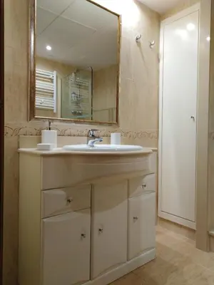 a bathroom with a sink and a mirror at PATACONA MARE NOSTRUM APARTMENT II in Valencia