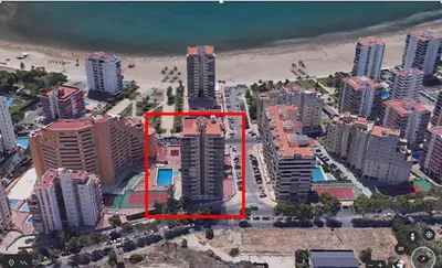 an aerial view of a city with tall buildings at AGUAMARINA C, 11-51 in Cullera