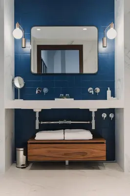 a bathroom with a sink and a mirror at Room Mate Collection Helen Berger in Valencia