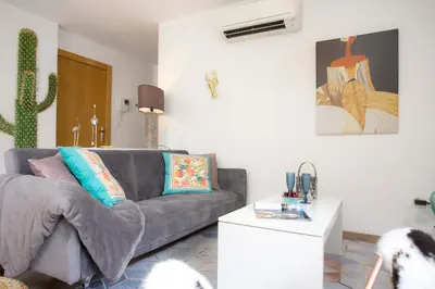 a living room with a couch and a table at SingularStays Valencia Center in Valencia