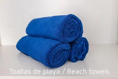 a pile of blue towels sitting on a counter at SingularStays Valencia Center in Valencia