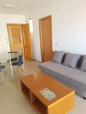 a living room with a couch and a table at Moncofa Beach in Moncófar