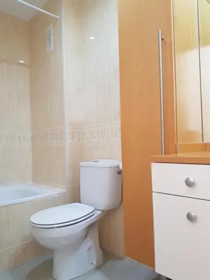 a bathroom with a toilet and a bath tub at Moncofa Beach in Moncófar