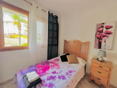 a bedroom with a bed and a window at Valencia Sol y Playa in Sagunto
