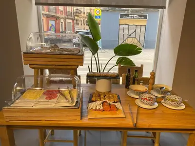 a table with many different types of food on it at YOU & CO. Quart Boutique in Valencia