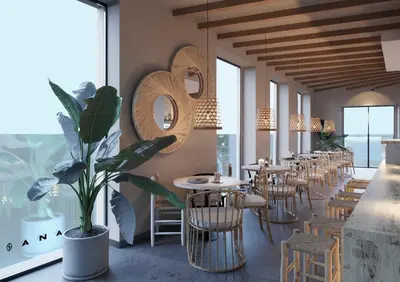 a restaurant with a row of tables and chairs at YOU & CO. Quart Boutique in Valencia