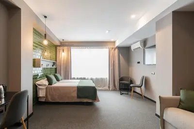 a bedroom with a bed and a large window at Nest Style Valencia in Valencia