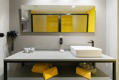 a bathroom with a sink and a mirror at Nest Style Valencia in Valencia
