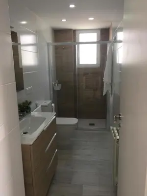 a bathroom with a shower and a sink and a toilet at Casa Ferrada in Burriana