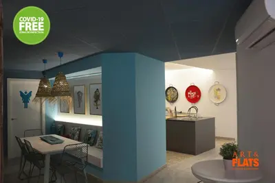 a room with a table and a dining room at Art&Flats Hostel in Valencia