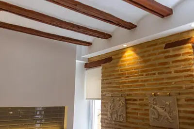 a brick wall in a room with a window at FLORIT FLATS - CENTER MODERN 1BR 2Bth TERRACE WI-FI AC in Valencia