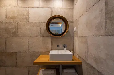 a bathroom with a sink and a mirror on a wall at FLORIT FLATS - CENTER MODERN 1BR 2Bth TERRACE WI-FI AC in Valencia