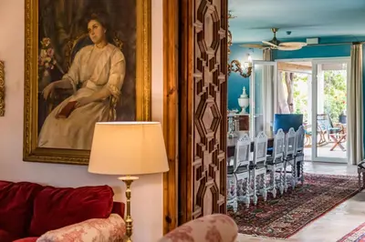 a living room with a painting on the wall at Alquería Calatrava B&B in Burriana