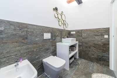 a bathroom with a toilet and a sink at FLORIT FLATS - CATHEDRAL LUXURY TERRACE FLAT 2BR 2BA AC Wifi in Valencia