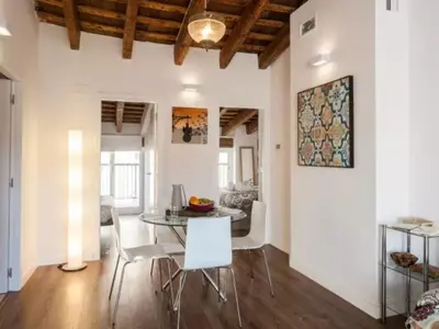 a dining room and living room with a table and chairs at FLORIT FLATS - CENTER 2BR 2BA ATTIC TERRACE VIEW WIFi AC in Valencia
