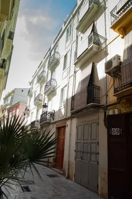 a large white building with balconies on a street at FLORIT FLATS - CENTER 2BR 2BA ATTIC TERRACE VIEW WIFi AC in Valencia