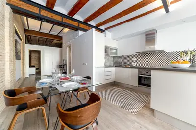 a kitchen and dining room with a table and chairs at FLORIT FLATS - CENTER Luxurious 1BR 1BA Terrace WI-FI AC in Valencia