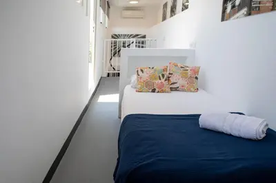 a bedroom with a bed with a blue blanket at FLORIT FLATS - Cabanyal 3 Bedroom WIFI AC Terrace Beach Penthouse in Valencia