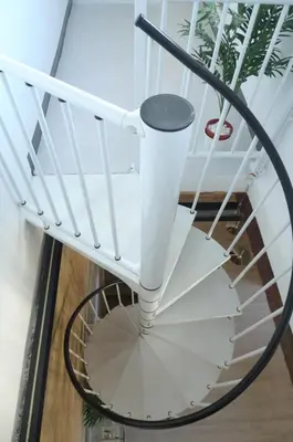 a white spiral staircase with a black rail at FLORIT FLATS - Cabanyal 3 Bedroom WIFI AC Terrace Beach Penthouse in Valencia