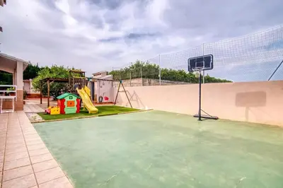 a basketball court with a basketball hoop at Family Villa in Benifayó with Year-Round Private Pool in Benifayó